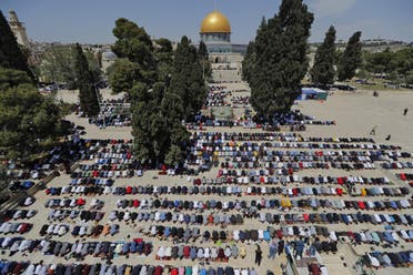 Palestinians take part in the first Friday prayers of the Muslim fasting month of Ramadan, at the Al-Aqsa Mosque compound, Islam’s third holiest site, in Jerusalem’s Old City, on April 16, 2021. (AFP)