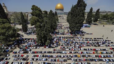 Palestinians take part in the first Friday prayers of the Muslim fasting month of Ramadan, at the Al-Aqsa Mosque compound, Islam's third holiest site, in Jerusalem's Old City, on April 16, 2021. (AFP)