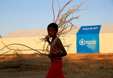 An Ethiopian refugee fleeing from the ongoing fighting in Tigray region, walks past a world food program tent, at the Um-Rakoba camp, on the Sudan-Ethiopia border, in the Al-Qadarif state, Sudan November 23, 2020. (File photo: Reuters)