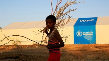 An Ethiopian refugee fleeing from the ongoing fighting in Tigray region, walks past a world food program tent, at the Um-Rakoba camp, on the Sudan-Ethiopia border, in the Al-Qadarif state, Sudan November 23, 2020. Picture taken November 23, 2020. (File photo: Reuters)