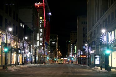 St. Catherine Street, a primary commercial artery of downtown Montreal is seen on the first night after a curfew is imposed by the Quebec government to help slow the spread of the coronavirus disease (COVID-19) pandemic in Montreal, Quebec, Canada January 9, 2021. (Reuters)