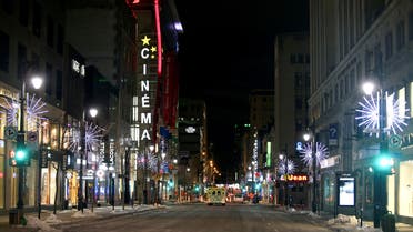St. Catherine Street, a primary commercial artery of downtown Montreal is seen on the first night after a curfew is imposed by the Quebec government to help slow the spread of the coronavirus disease (COVID-19) pandemic in Montreal, Quebec, Canada January 9, 2021. (Reuters)
