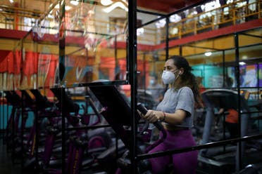 A woman exercises on a machine in Antiguo Cuscatlan, El Salvador. (Reuters)