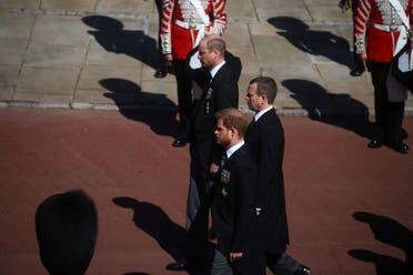Britain's Prince Harry, Duke of Sussex, Peter Phillips and Britain's Prince William, Duke of Cambridge follow the hearse, a specially modified Land Rover, near St George's Chapel during the funeral of Britain's Prince Philip, husband of Queen Elizabeth, who died at the age of 99, on the grounds of Windsor Castle in Windsor, Britain, April 17, 2021. (Reuters)