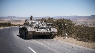 A damaged tank stands on a road north of Mekele, the capital of Tigray on February 26, 2021. (AFP)