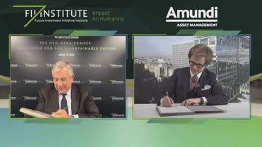 The FII Institute's Richard Attias (L) and Amundi's Jean-Jacques Barbéris sign an MoU to partner on ESG. (Supplied)