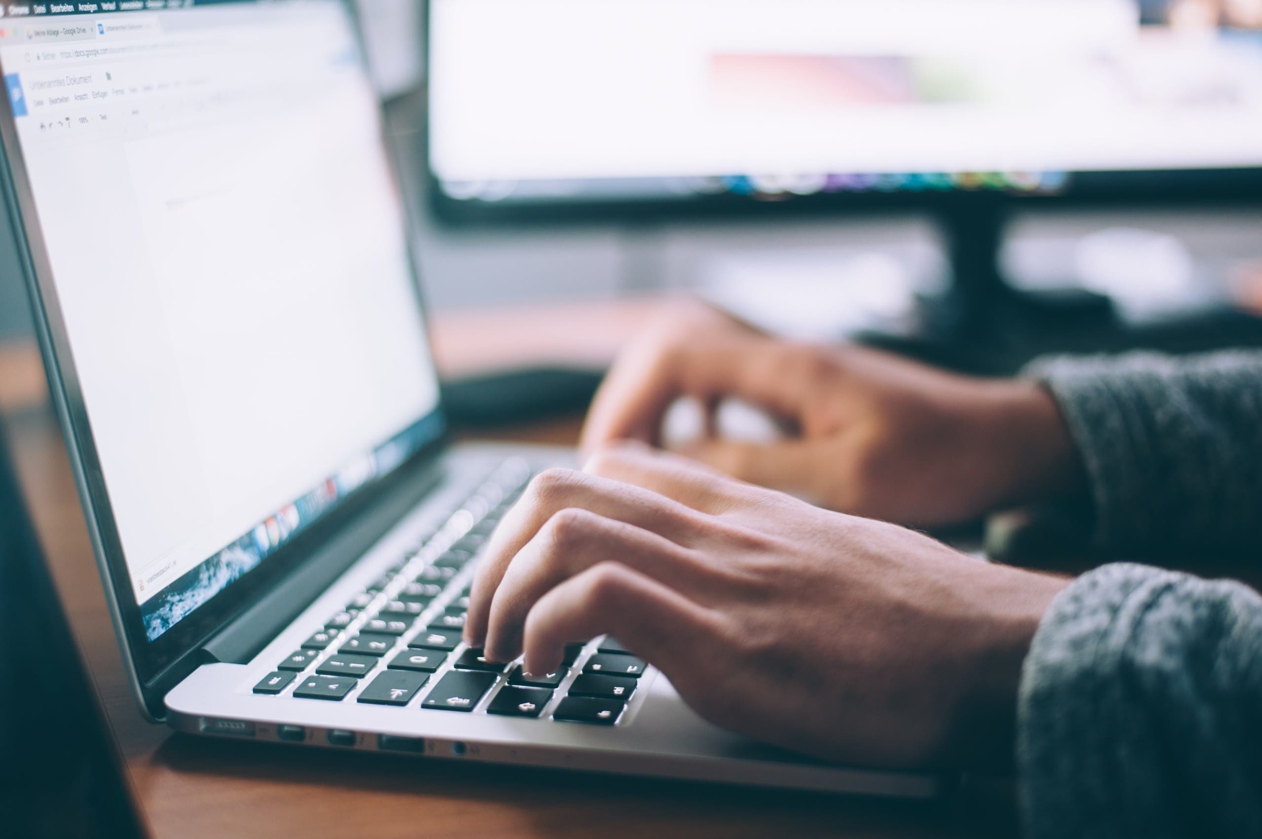 Man typing on a laptop keyboard browses the web. (File image: Unsplash)