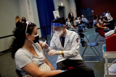 A woman receives a dose of the Johnson & Johnson coronavirus disease (COVID-19) vaccine at vaccination center in Chinatown, in Chicago, Illinois, US, April 6, 2021. (File photo: Reuters)
