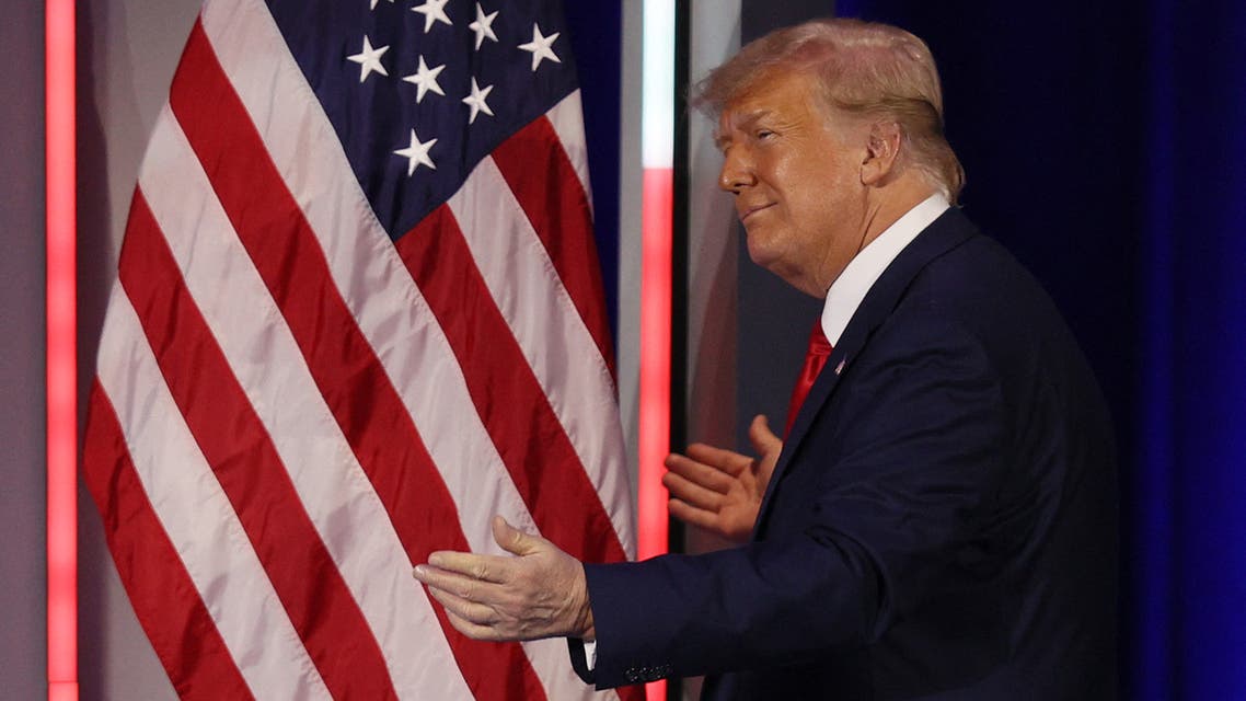 ORLANDO, FLORIDA - FEBRUARY 28: Former President Donald Trump embraces the American flag as he arrives on stage to address the Conservative Political Action Conference held in the Hyatt Regency on February 28, 2021 in Orlando, Florida. Begun in 1974, CPAC brings together conservative organizations, activists, and world leaders to discuss issues important to them. Joe Raedle/Getty Images/AFP