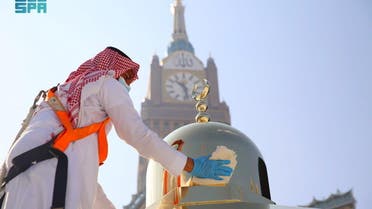 An official from the office of the President General of the two Holy Mosque Affairs cleans and scents the Kabaa in the Grand Mosque, in the holy city of Mecca, Saudi Arabia, April 14, 2021. Saudi Press Agency/Handout via REUTERS ATTENTION EDITORS - THIS PICTURE WAS PROVIDED BY A THIRD PARTY