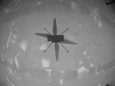 This NASA photo obtained on April 19, 2021 shows NASA’s Ingenuity Mars Helicopter captured in this shot as it hovered over the Martian surface on April 19, 2021. (AFP)