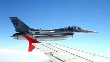 This photo taken on July 15, 2017 and released by Turkey's Presidential Press Service shows an F-16 fighter jet flying on the wing of the Turkey's president Recep Tayyip Erdogan's plane, while travelling from Ankara to Istanbul, to attend the July 15 Democracy and Unity Day commemoration of first year anniversary of the 2016 failed coup attempt.