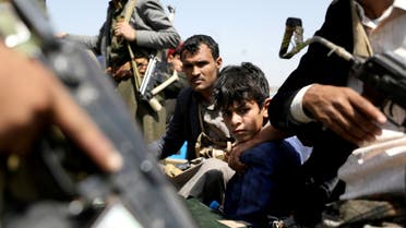 FILE PHOTO: A boy rides with Houthi followers on the back of a patrol truck during the funeral of Houthi fighters killed during recent battles against government forces, in Sanaa, Yemen September 22, 2020. REUTERS/Khaled Abdullah/File Photo