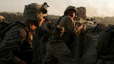 US Marines fire during a Taliban ambush as they carry out an operation to clear an area in Helmand province, Afghanistan, October 9, 2009. (Reuters)