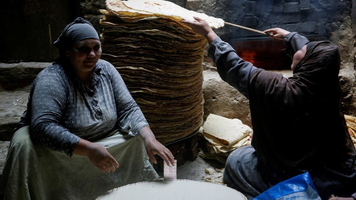 Nour El-Sabah, 35, prepares traditional food with her family to sell during the holy month of Ramadan in Beni Suef, Egypt, on April 10, 2021. (Reuters)