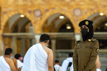Photos of a Saudi female police officer supervising Umrah pilgrims during the holy month of Ramadan in Saudi Arabia’s Mecca. (SPA)