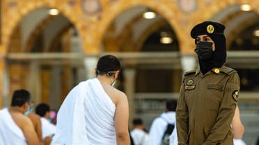 Photos of a Saudi female police officer supervising Umrah pilgrims during the holy month of Ramadan in Saudi Arabia’s Mecca. (SPA)