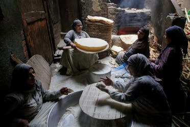 Nour El-Sabah, 35, prepares traditional food with her family to sell during the holy month of Ramadan in Beni Suef, Egypt.. (Reuters)