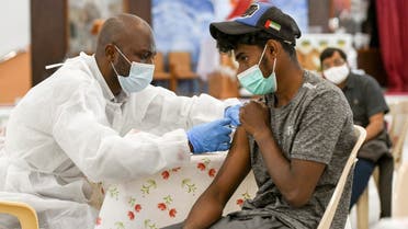 A man receives a dose of a vaccine against the coronavirus disease (COVID-19)at St. Paul's Church in Abu Dhabi, United Arab Emirates January 16, 2021. (Reuters)