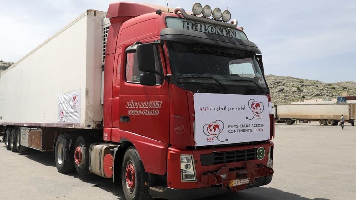 A truck carrying vaccines against the coronavirus disease (COVID-19) is seen at Bab al-Hawa crossing at the Syrian-Turkish border, in Idlib governorate, Syria, on April 21, 2021. (Reuters)