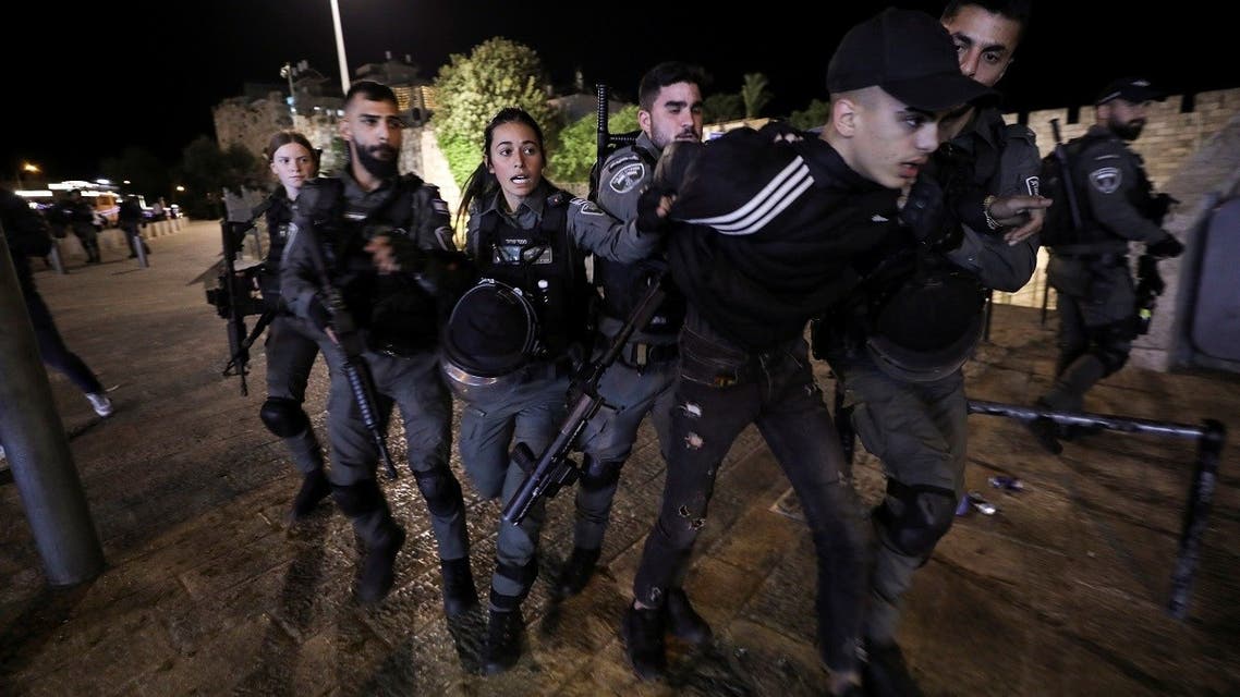 Israeli border police detain a Palestinian youth during clashes near Damascus Gate just outside Jerusalem’s Old City, on the Muslim holy fasting month of Ramadan on April 21, 2021. (Reuters)