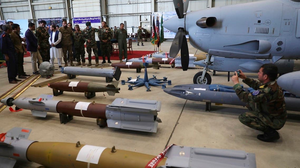 Afghan army officers stand near A-29 Super Tucanos after hand over from Resolute Support (RS) to Afghan army at the military Airport in Kabul, Afghanistan, Sept. 17, 2020. (AP)