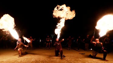Burning Man participants from the Northern Fire Dynamic fire conclave out of Minnesota, Wisconsin and Iowa breath fire simultaneously during their fire dance performance in front of the effigy of The Man just before it was burned at the culmination of the annual Burning Man arts and music festival in the Black Rock desert of Nevada, US September 2, 2017. (File photo: Reuters)