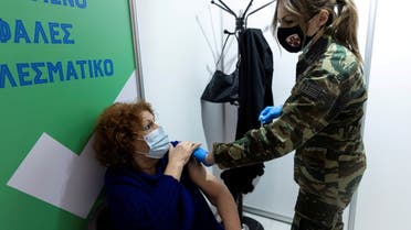 A woman speaks with a military doctor after receiving a dose of the Moderna vaccine against the coronavirus disease (COVID-19) at a newly opened vaccination center in Athens, Greece, April 2, 2021. (File Photo: Reuters)
