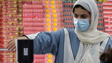 A Saudi woman measures her temperature as she enters the Al-Othaim market amid the spread of the coronavirus disease (COVID-19) in Riyadh, Saudi Arabia February 22, 2021. Picture taken February 22, 2021. (File photo: Reuters)
