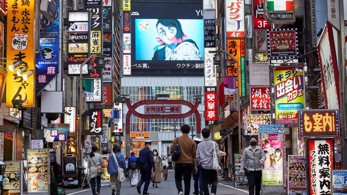 FILE PHOTO: Passersby wearing protective masks stroll through Kabukicho entertainment district during the COVID-19 pandemic in Tokyo, Japan April 6, 2021. Picture taken April 6, 2021. (File Photo: Reuters)