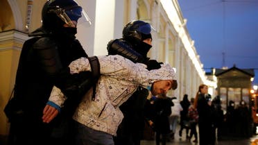 A demonstrator is taken away by law enforcement officers during a rally in support of jailed Russian opposition politician Alexei Navalny in Saint Petersburg, Russia April 21, 2021. (Reuters)