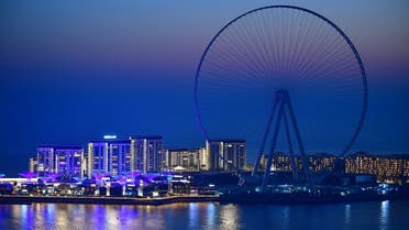 A boat sails in front of the Ain Dubai (Dubai Eye) ferris wheel located on the Bluewaters island in the Gulf city of Dubai, on May 28, 2020. (AFP)