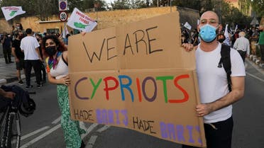 Greek Cypriots march peacefully during a reunification rally along the medieval walls circling the divided capital Nicosia, Cyprus April 24, 2021. (Reuters/Yiannis Kourtoglou)