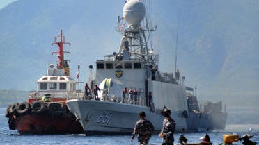 The Indonesian Navy patrol boat KRI Singa (651) prepares to load provisions at the naval base in Banyuwangi, East Java province, on April 24, 2021, as the military continues search operations off the coast of Bali for the Navy's KRI Nanggala (402) submarine that went missing April 21 during a training exercise. (AFP)