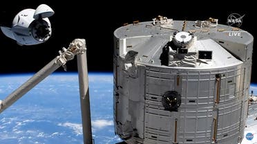 This screen grab taken from the NASA live feed shows the SpaceX's Crew Dragon spacecraft at 20 meters of the docking access of the International Space Station on April 24. A recycled SpaceX Crew Dragon capsule with four astronauts aboard, ESA (European Space Agency) astronaut Thomas Pesquet, NASA astronauts Megan McArthur and Shane Kimbrough, and Japan Aerospace Exploration Agency (JAXA) astronaut Akihiko Hoshide, was speeding on its way to the International Space Station, where the spacecraft is set to dock early Saturday. (AFP)