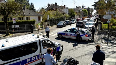 French police officials block off a street near a police station in Rambouillet, south-west of Paris, on April 23, 2021, after a woman was stabbed to death in the town. A female police employee was stabbed to death by a Tunisian man at a police station southwest of Paris on Friday, the local prosecutor's office and a police source told AFP. The attacker was fatally wounded when an officer opened fire on him at the station in Rambouillet, a wealthy commuter town about 60 kilometres from Paris, a police source told AFP.
