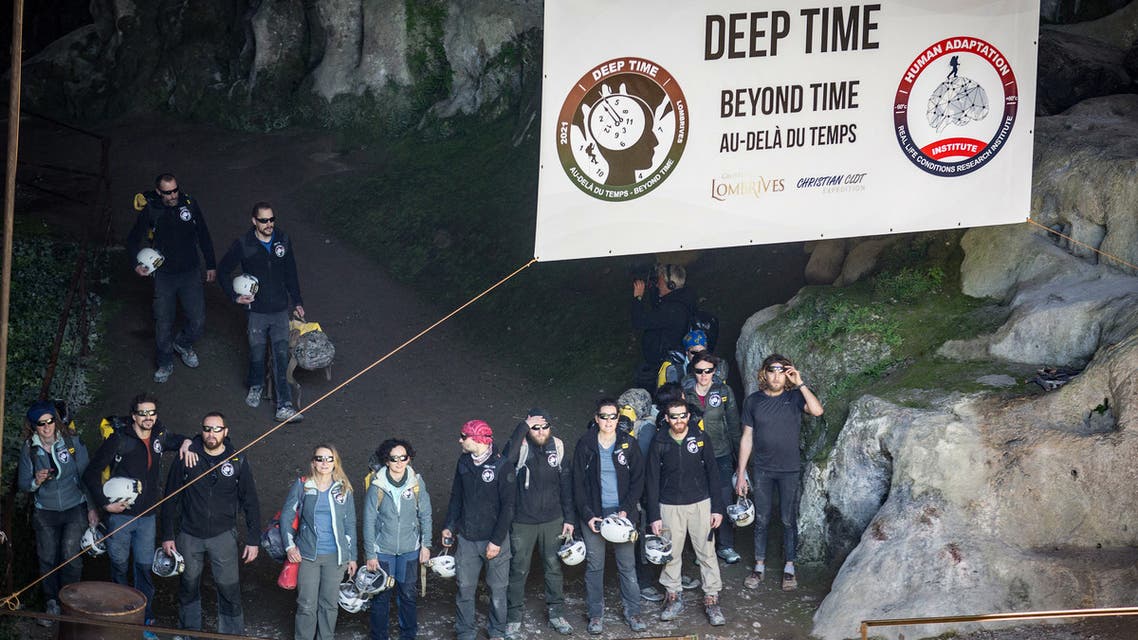 Volunteers leave the Lombrives cave after spending 40 days in the cave in Ussat-les-Bains, southern of France, on April 24, 2021. After 40 days out of time (no watch, telephone or natural light) seven women and eight men aged between 27 and 50 left the Pyrenees cave in which they had voluntarily confined themselves. (AFP)