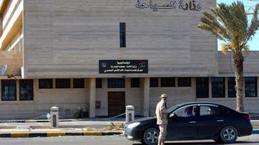 A Member of the Libyan security forces mans a checkpoint in front of the ministry of tourism in the capital Tripoli, to insure that the strict measures taken by the authorities to stem the spread of the novel coronavirus are respected, on April 10, 2020. AFP