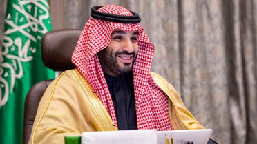 A handout picture provided by the Saudi Royal Palace on December 24, 2020 shows Saudi Crown Prince Mohammed bin Salman attending by videoconference a meeting with Bahrain's Crown Prince of the Saudi-Bahraini Coordinating Council