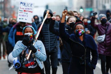 People march down Colfax Avenue during a demonstration protesting police violence after the verdict in the trial of former Minneapolis police officer Derek Chauvin, found guilty of the death of Floyd, in Denver, Colorado, US, April 20, 2021. (Reuters)