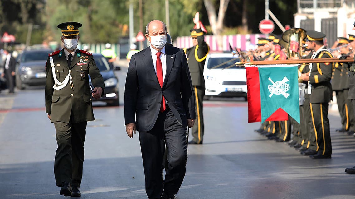 A handout picture released by the Presidency of the self-proclaimed Turkish Republic of Northern Cyprus (KKTCB) on October 23, 2020, shows Ersin Tatar, the newly-elected Turkish Cypriot President, arriving for the oath-taking ceremony at the parliament headquarters in the northern part of Nicosia, the capital of the self-proclaimed TRNC. (AFP)