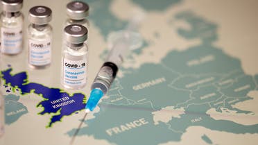 Vials labelled COVID-19 Coronavirus-Vaccine and medical syringe are placed on the European Union map in this picture illustration taken December 2, 2020. (Reuters)