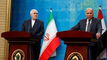 Iraqi foreign minister Fuad Hussein speaks during a joint statement with his Iranian counterpart Mohammad Javad Zarif in Baghdad, Iraq April 26, 2021. (Reuters)