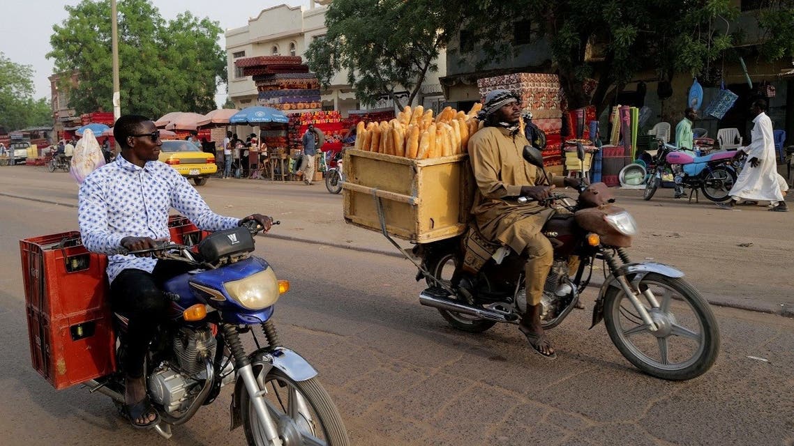 Men on motorcycles drive along the street in N’djamena, Chad, on April 25, 2021. (Reuters)