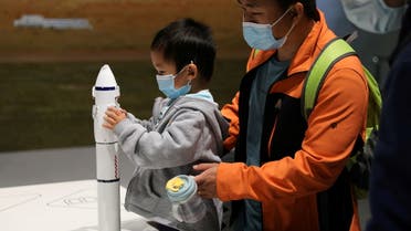 A child holds part of a rocket model at an exhibition featuring the development of China's space exploration on the country's Space Day at China Science and Technology Museum in Beijing, China April 24, 2021. (File photo: Reuters)