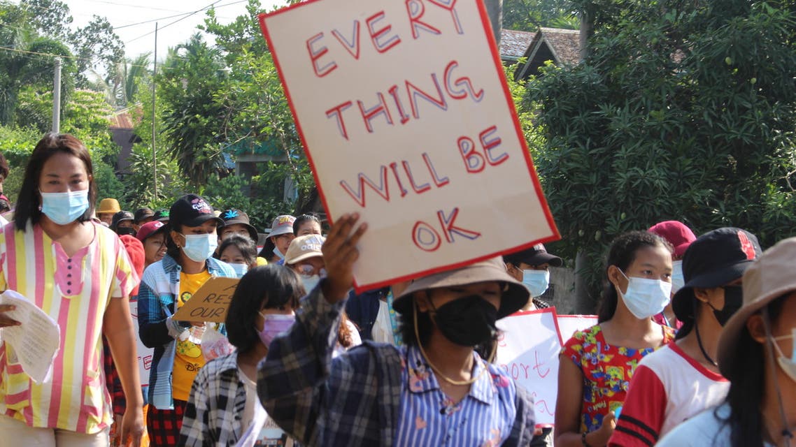 This handout photo taken and released by Dawei Watch on April 26, 2021 shows a protester holding a sign during a demonstration against the military coup in Pandale village in Dawei's Launglone township. (File phoTo: AFP)