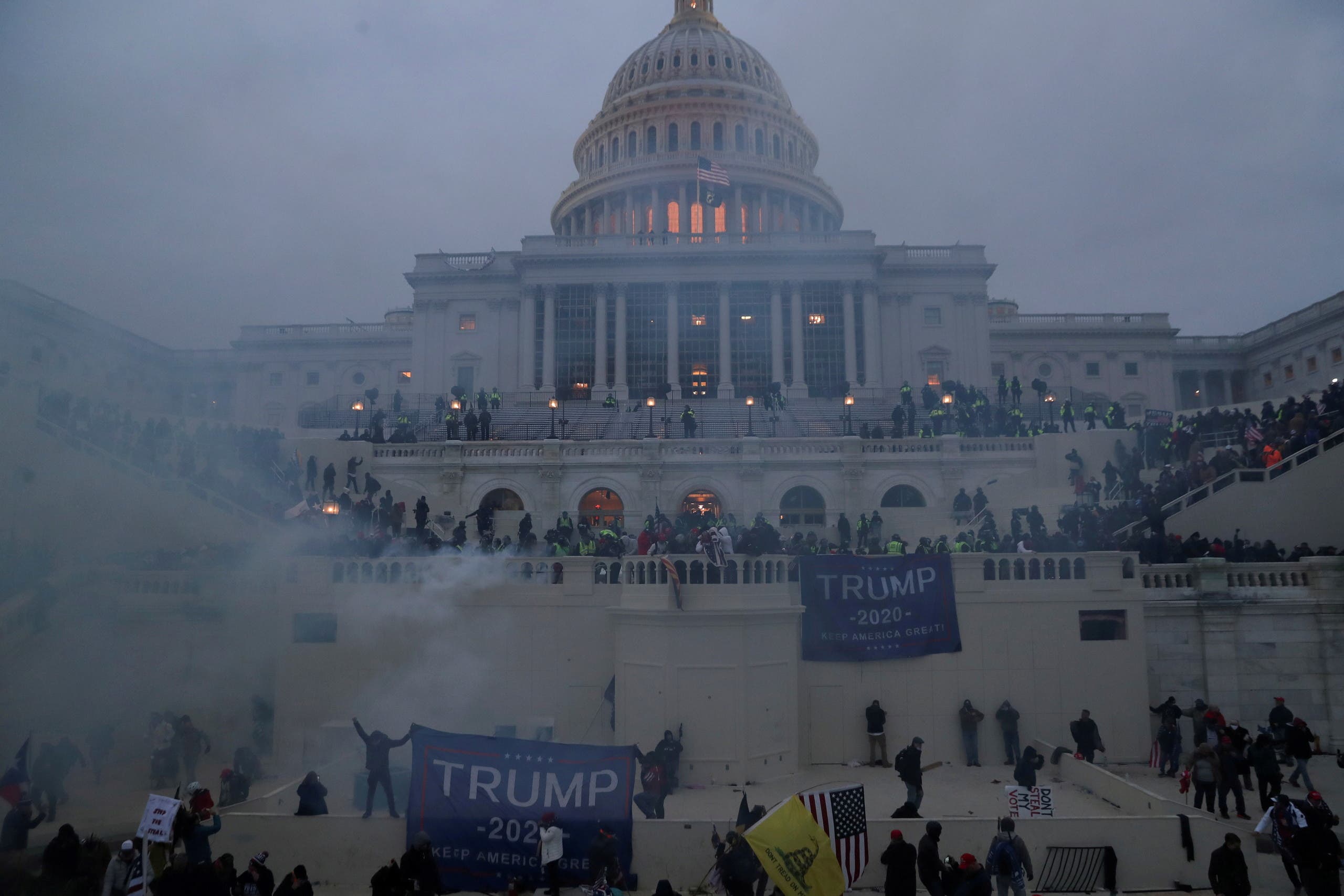 A file photo shows police officers stand guard as supporters of then President Trump gather in front of the US Capitol Building in Washington, US, January 6, 2021. (Reuters/Leah Millis)