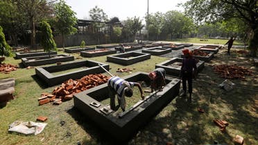 Workers build new platforms to cremate bodies inside a crematorium, amid the spread of the coronavirus disease (COVID-19) in New Delhi, India, April 26, 2021. (Reuters)