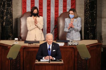 US President Joe Biden, flanked by Vice President Kamala Harris (L) and Speaker of the House Nancy Pelosi, addresses a joint session of Congress at the US Capitol in Washington, DC, on April 28, 2021. (AFP)