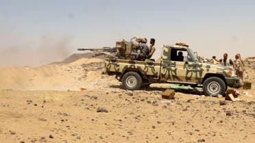 A Yemeni government fighter fires a vehicle-mounted weapon at a frontline position during fighting against Houthi fighters in Marib, Yemen March 28, 2021. Picture taken March 28, 2021. REUTERS/Ali Owidha